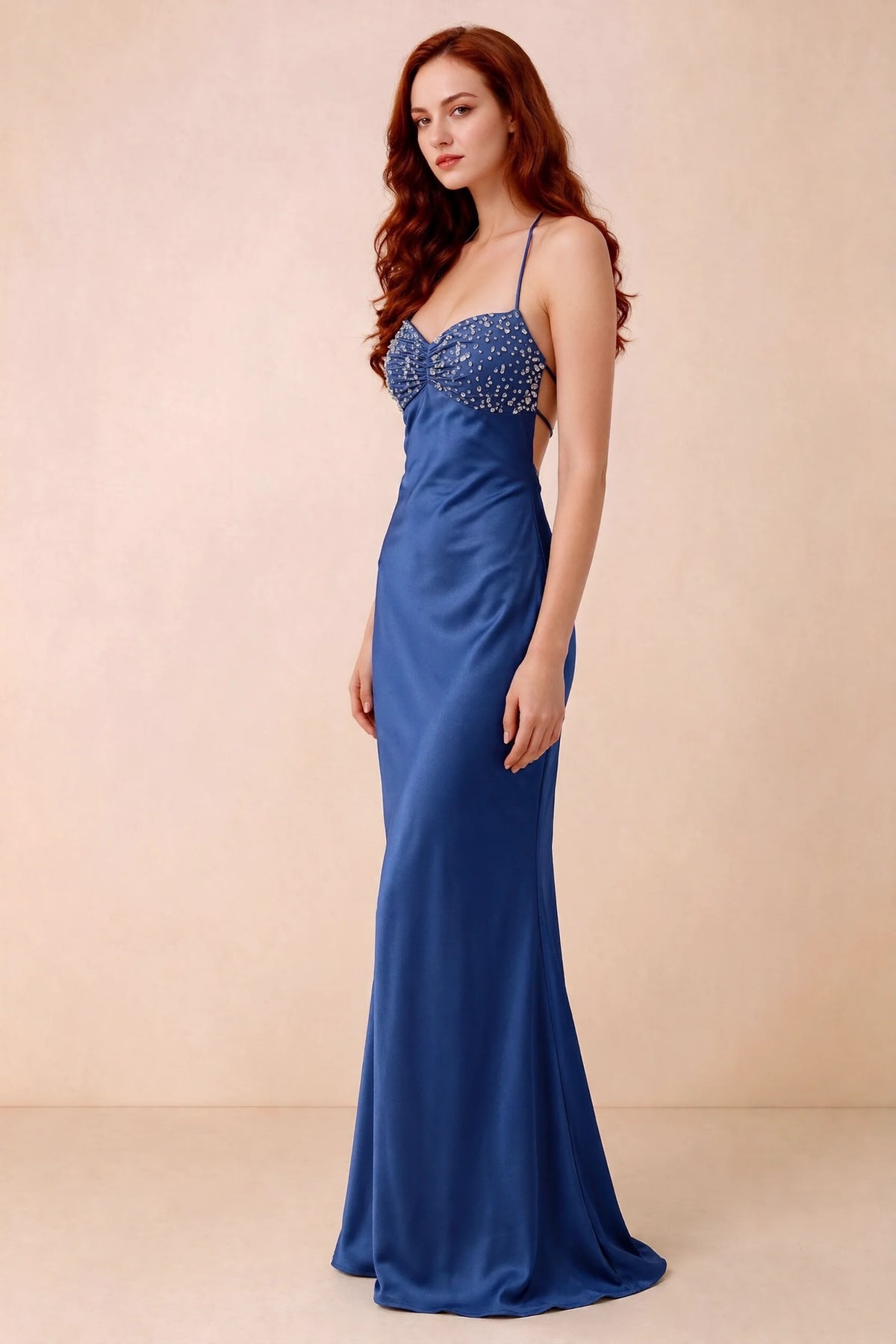 Three-quarter studio view of Blanche royal blue dress showing the fitted hips and flared long hem