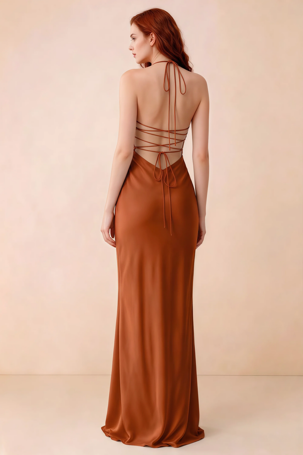 Back studio view of Blanche rust dress showing halter neck ties and crossed open-back lacing