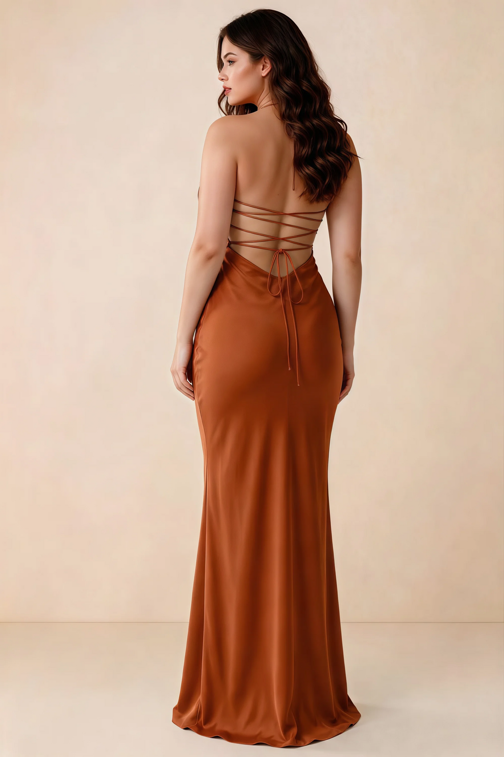 Rear studio view of Blanche rust satin dress showing the open back and mermaid silhouette