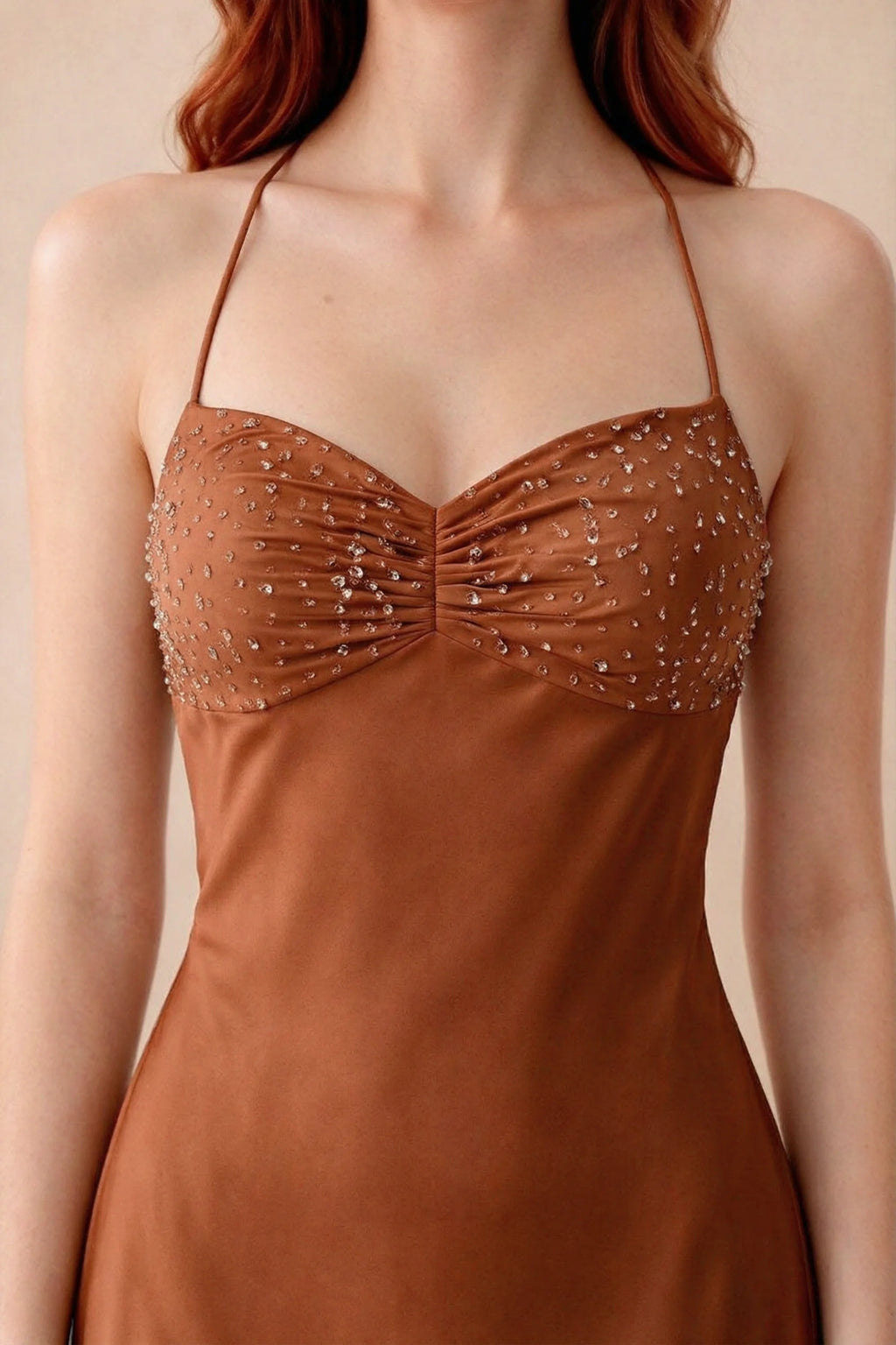Close-up of Blanche rust sweetheart neckline with beading, central ruching and fine halter straps