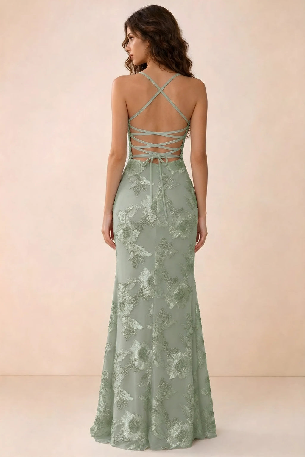 Back studio view of Belinda sage green maxi dress showing crossed straps and open-back ties