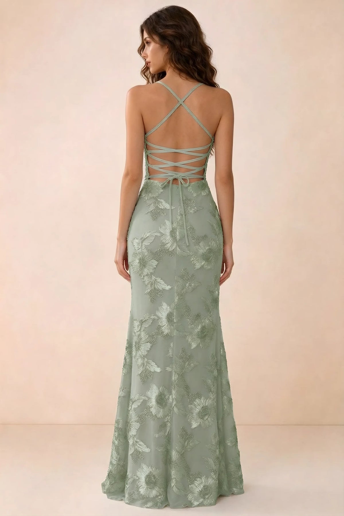 Back studio view of Belinda sage green maxi dress showing crossed straps and open-back ties