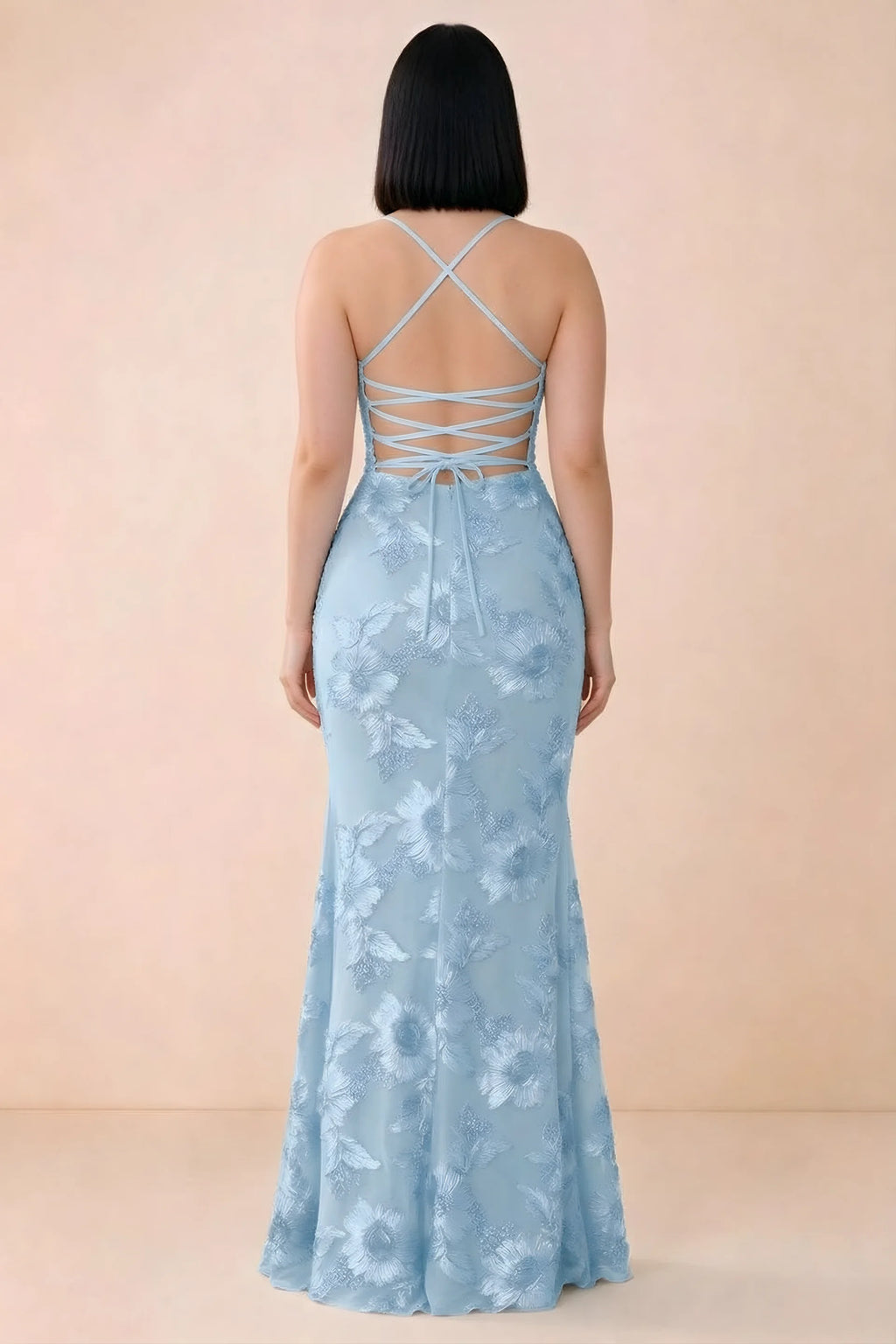 Rear studio view of Belinda sky blue dress showing the open back and gently flared skirt