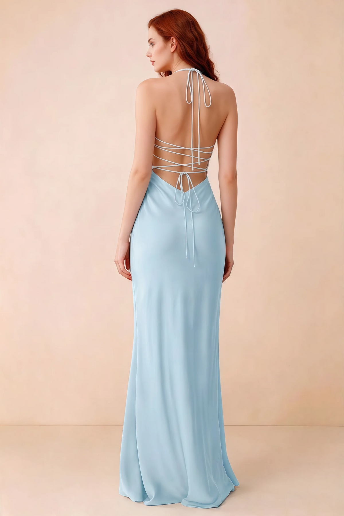 Back studio view of Blanche sky blue dress showing halter neck ties and crossed open-back lacing