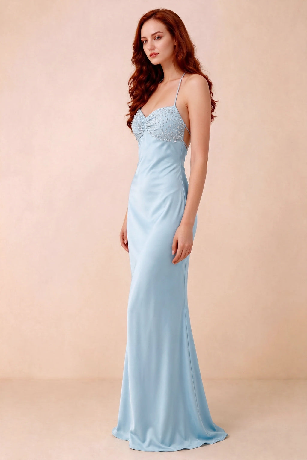 Three-quarter studio view of Blanche sky blue dress showing the fitted hips and flared long hem