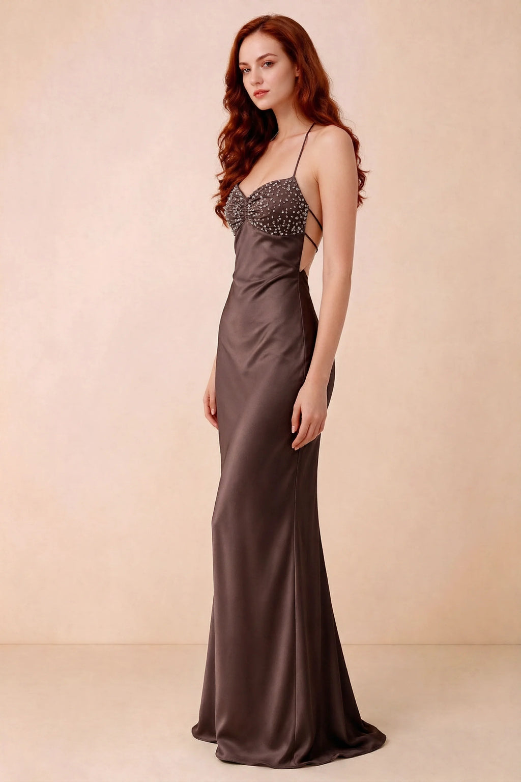 Three-quarter studio view of Blanche truffle dress showing the fitted hips and flared long hem