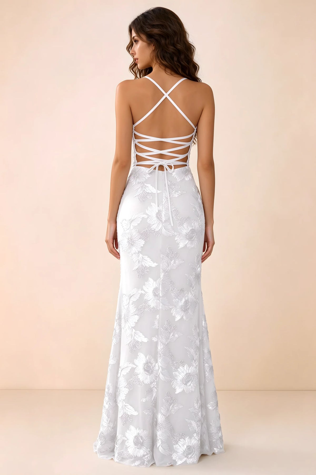 Back studio view of Belinda white maxi dress showing crossed straps and open-back ties