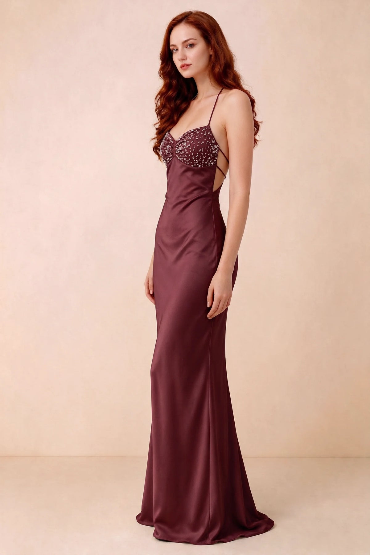Three-quarter studio view of Blanche wine dress showing the fitted hips and flared long hem
