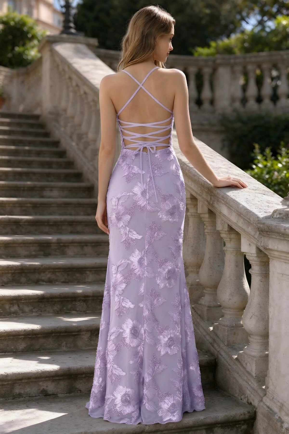 Outdoor rear view of Belinda wisteria mermaid maxi dress showing the crisscross back ties