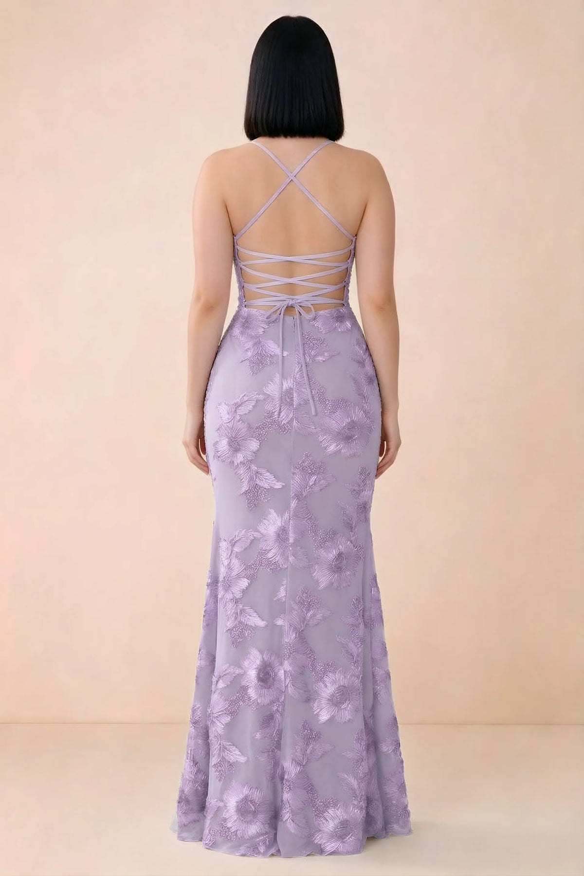 Rear studio view of Belinda wisteria dress showing the open back and gently flared skirt