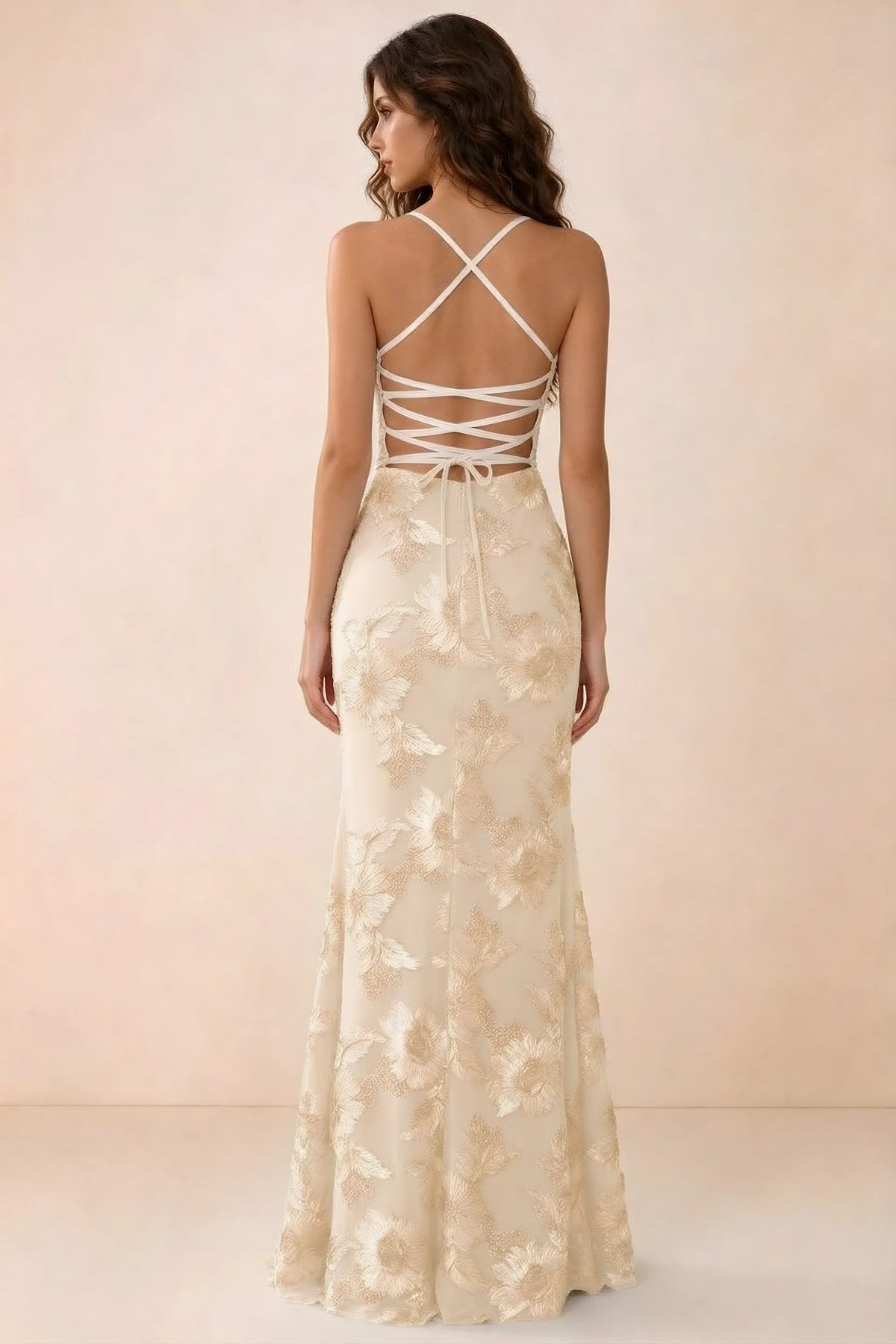 Back studio view of Belinda yellow maxi dress showing crossed straps and open-back ties