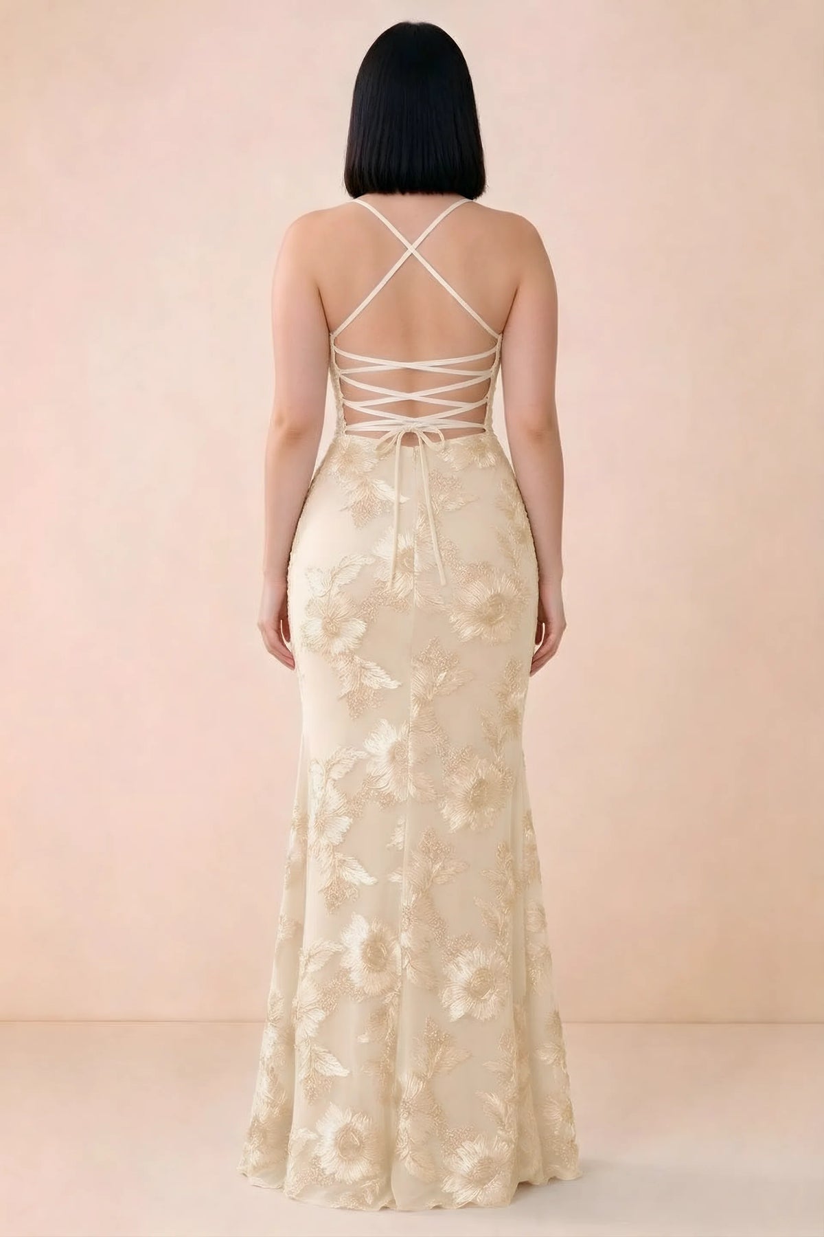 Rear studio view of Belinda yellow dress showing the open back and gently flared skirt