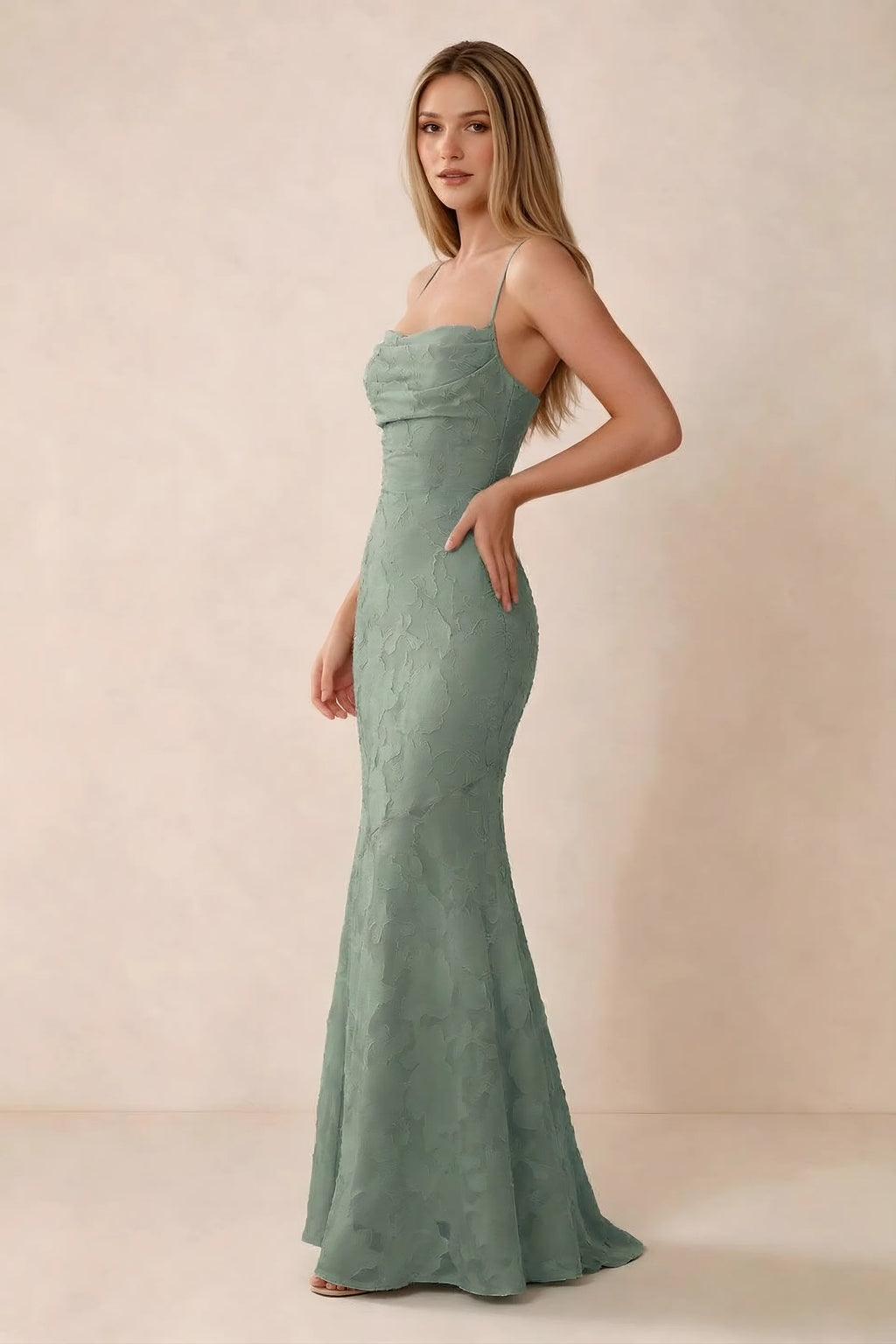Three-quarter studio view of Bess aloe green dress showing the close-fitting waist and gently flared hem