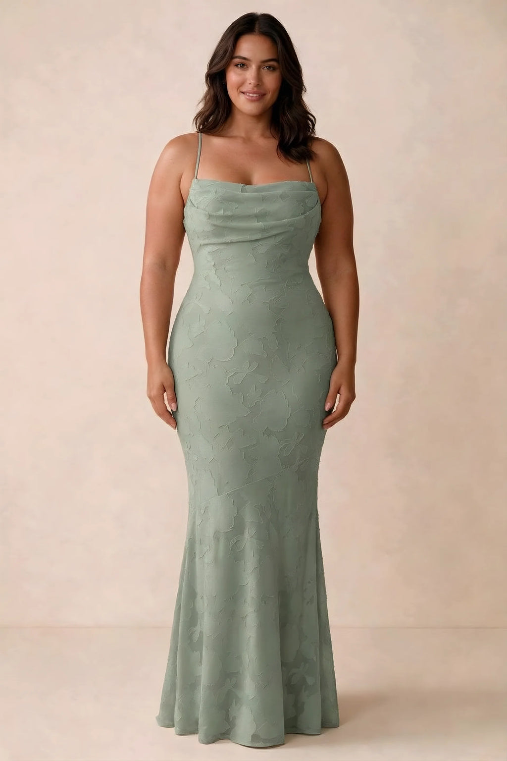 Front studio view of Bess aloe green maxi dress showing tonal floral texture and a long skirt