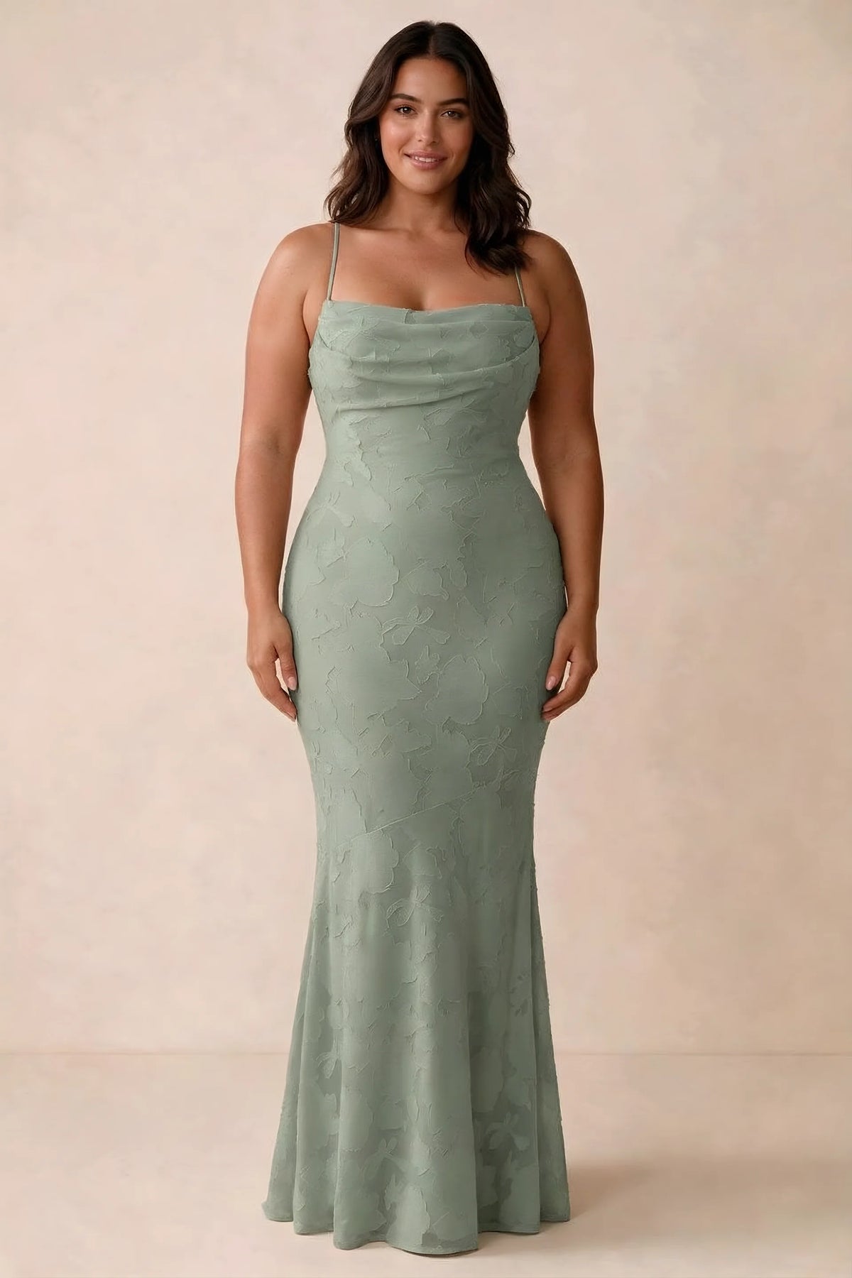 Front studio view of Bess aloe green maxi dress showing tonal floral texture and a long skirt