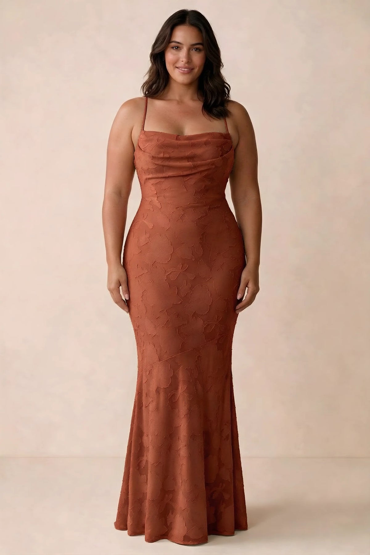 Front studio view of Bess auburn maxi dress showing tonal floral texture and a long skirt