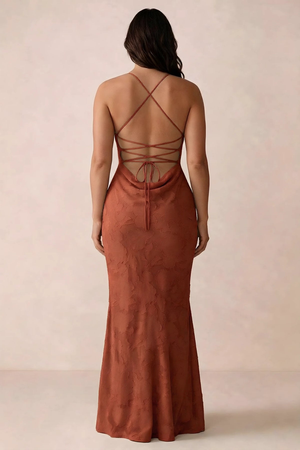 Back studio view of Bess auburn dress showing the crossed straps and full-length silhouette