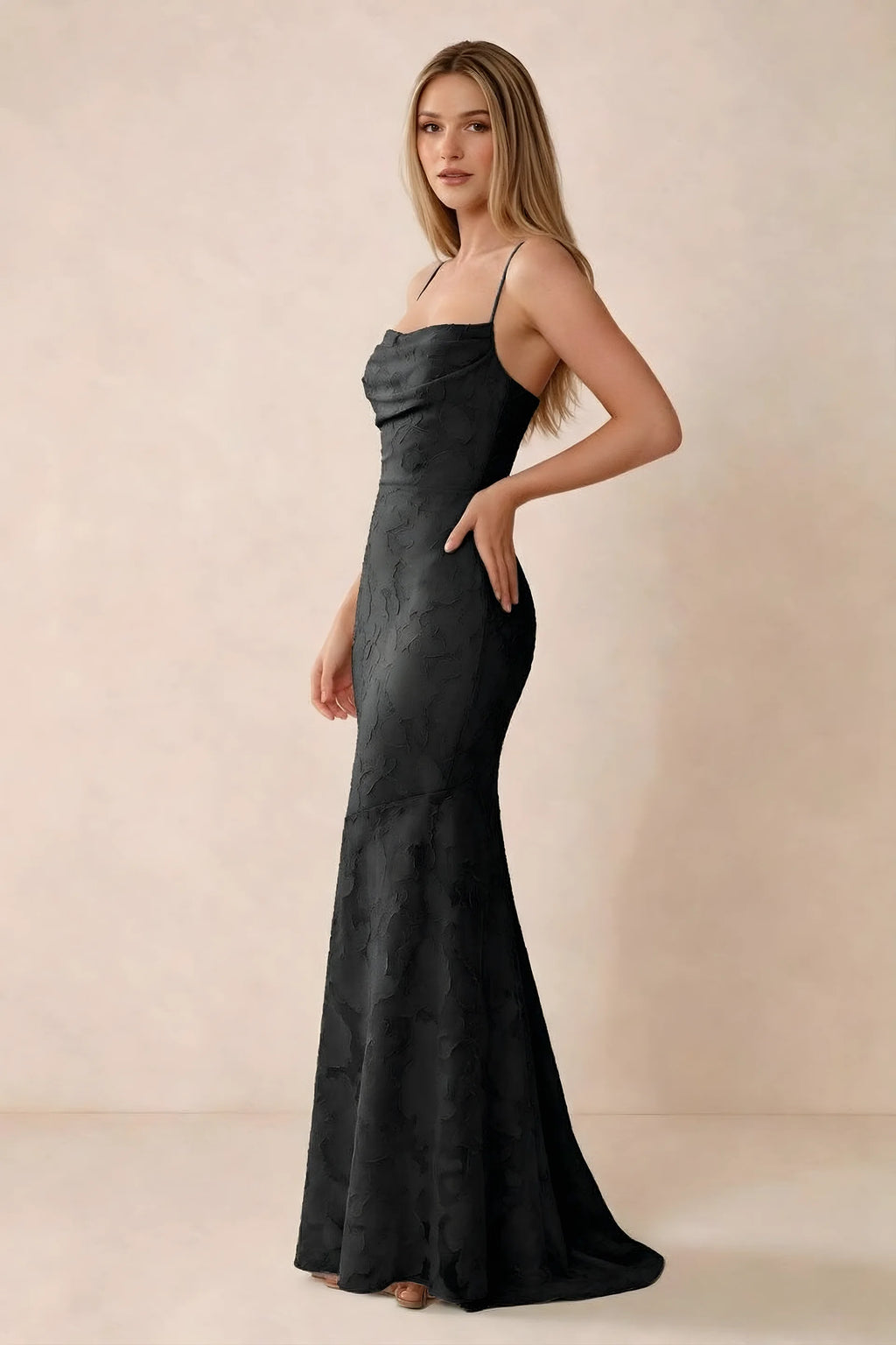 Three-quarter studio view of Bess black dress showing the close-fitting waist and gently flared hem