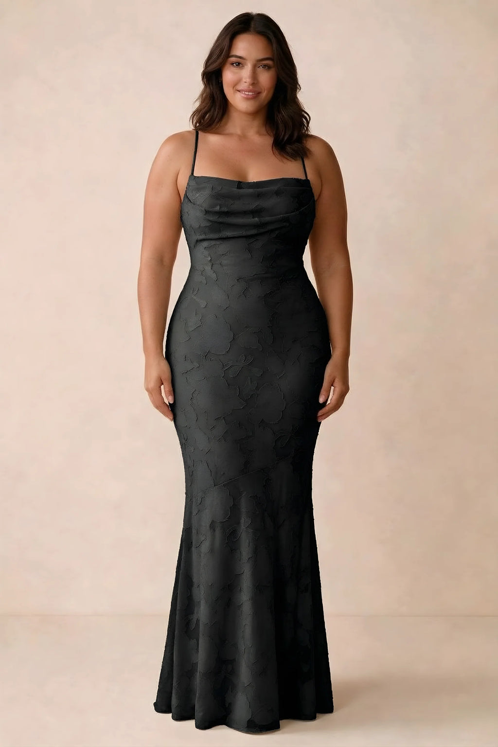 Front studio view of Bess black maxi dress showing tonal floral texture and a long skirt