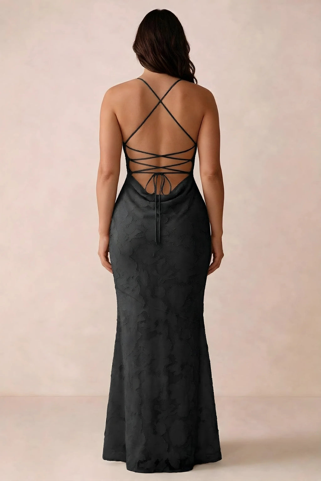 Back studio view of Bess black dress showing the crossed straps and full-length silhouette
