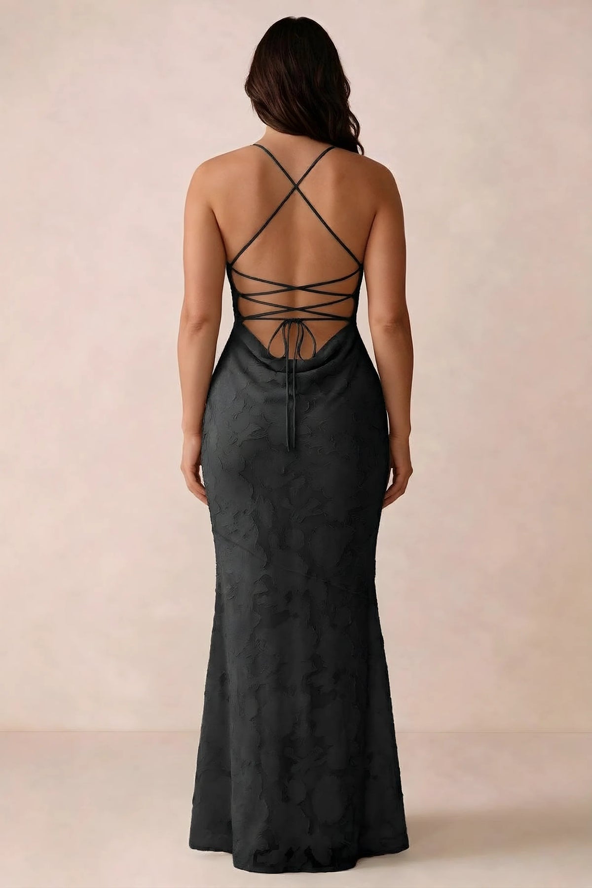 Back studio view of Bess black dress showing the crossed straps and full-length silhouette
