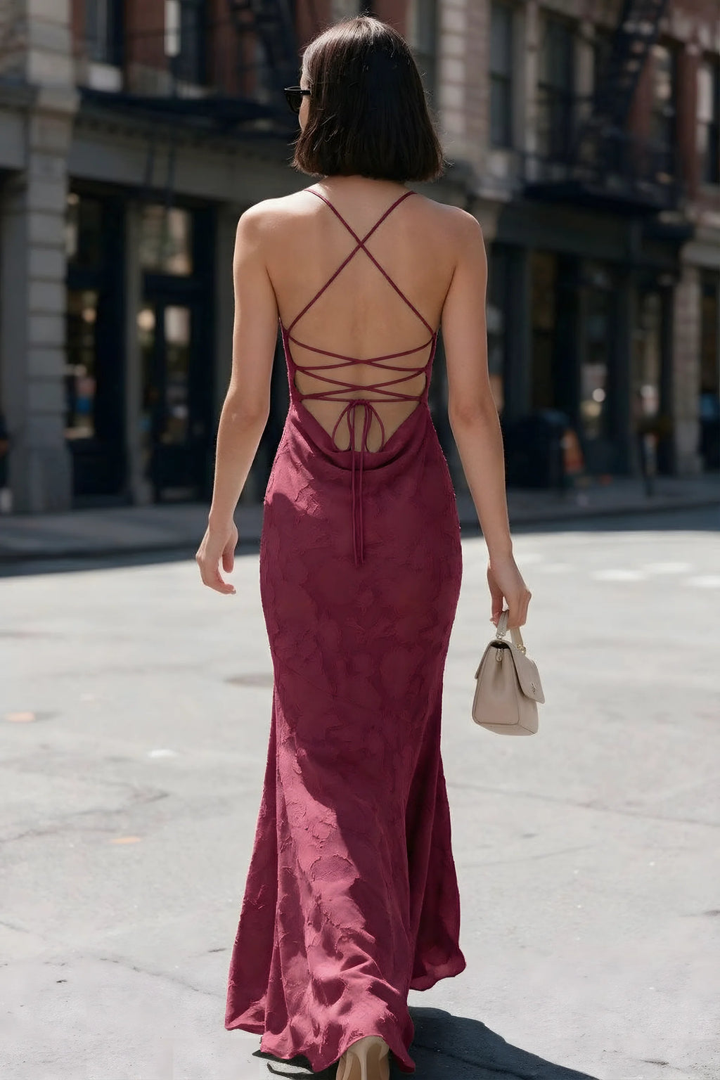 Outdoor back view of Bess burgundy maxi dress showing the open back and crisscross ties