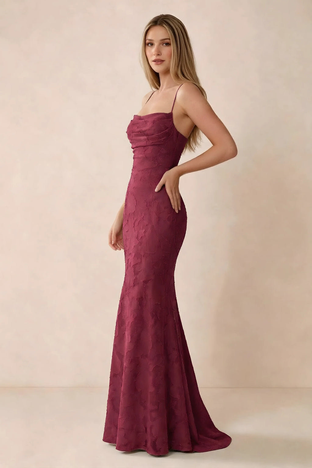 Three-quarter studio view of Bess burgundy dress showing the close-fitting waist and gently flared hem