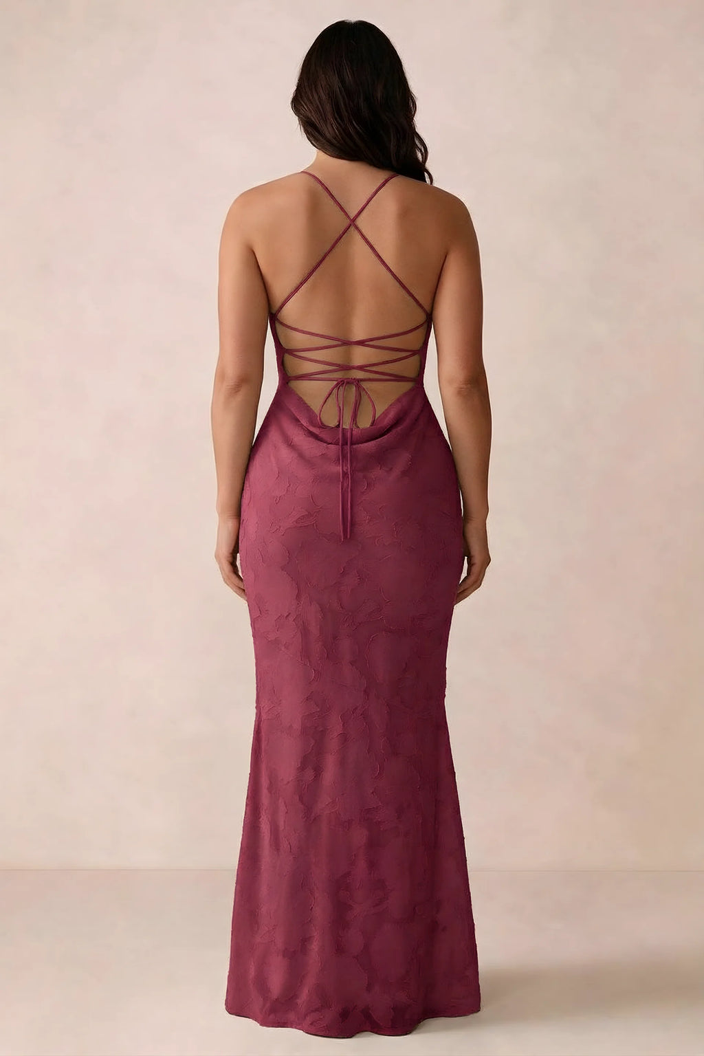 Back studio view of Bess burgundy dress showing the crossed straps and full-length silhouette