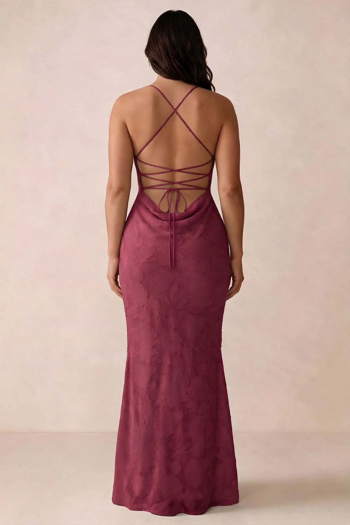 Back studio view of Bess burgundy dress showing the crossed straps and full-length silhouette