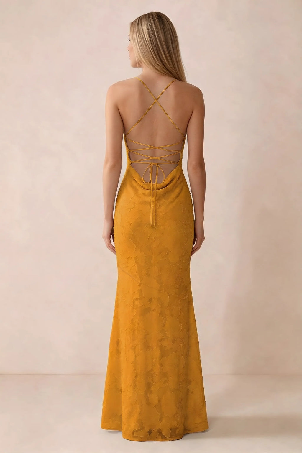 Rear studio view of Bess butterscotch dress showing cross-back lacing above a low cowl drape