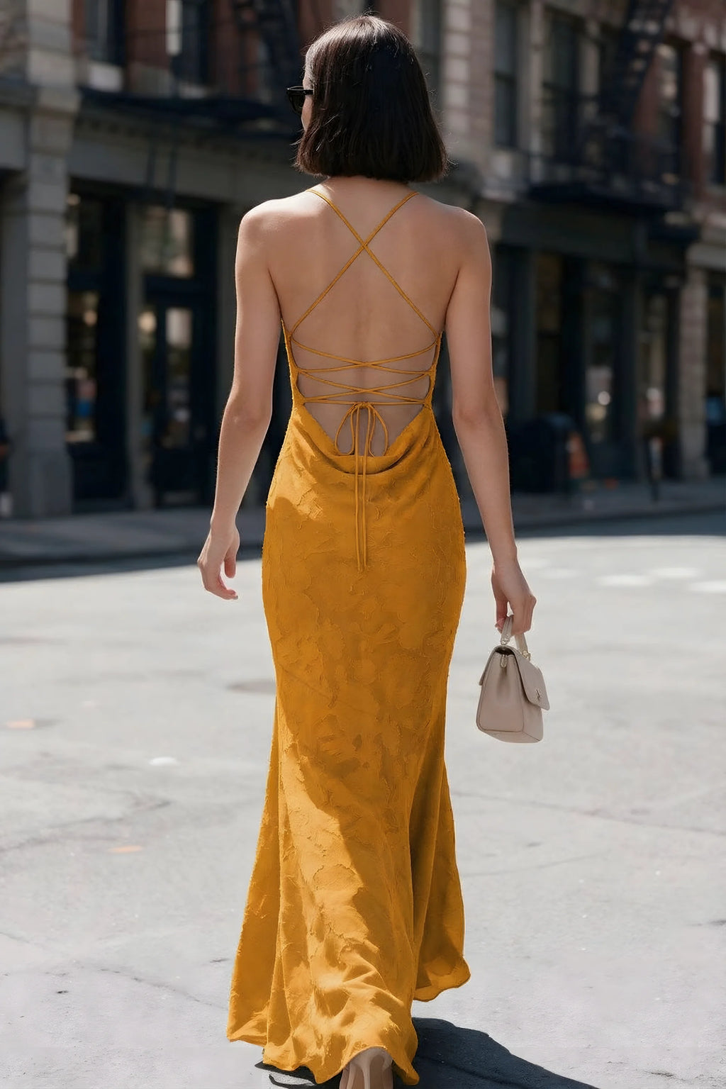 Outdoor back view of Bess butterscotch maxi dress showing the open back and crisscross ties