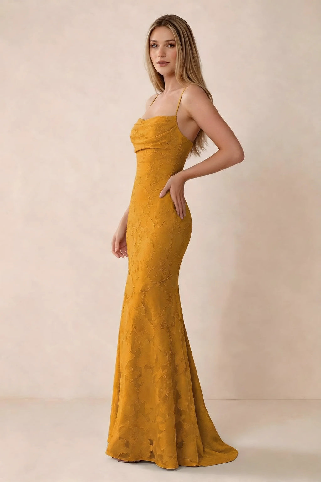 Three-quarter studio view of Bess butterscotch dress showing the close-fitting waist and gently flared hem