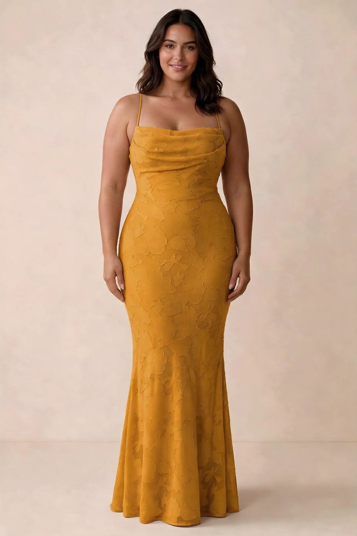 Front studio view of Bess butterscotch maxi dress showing tonal floral texture and a long skirt