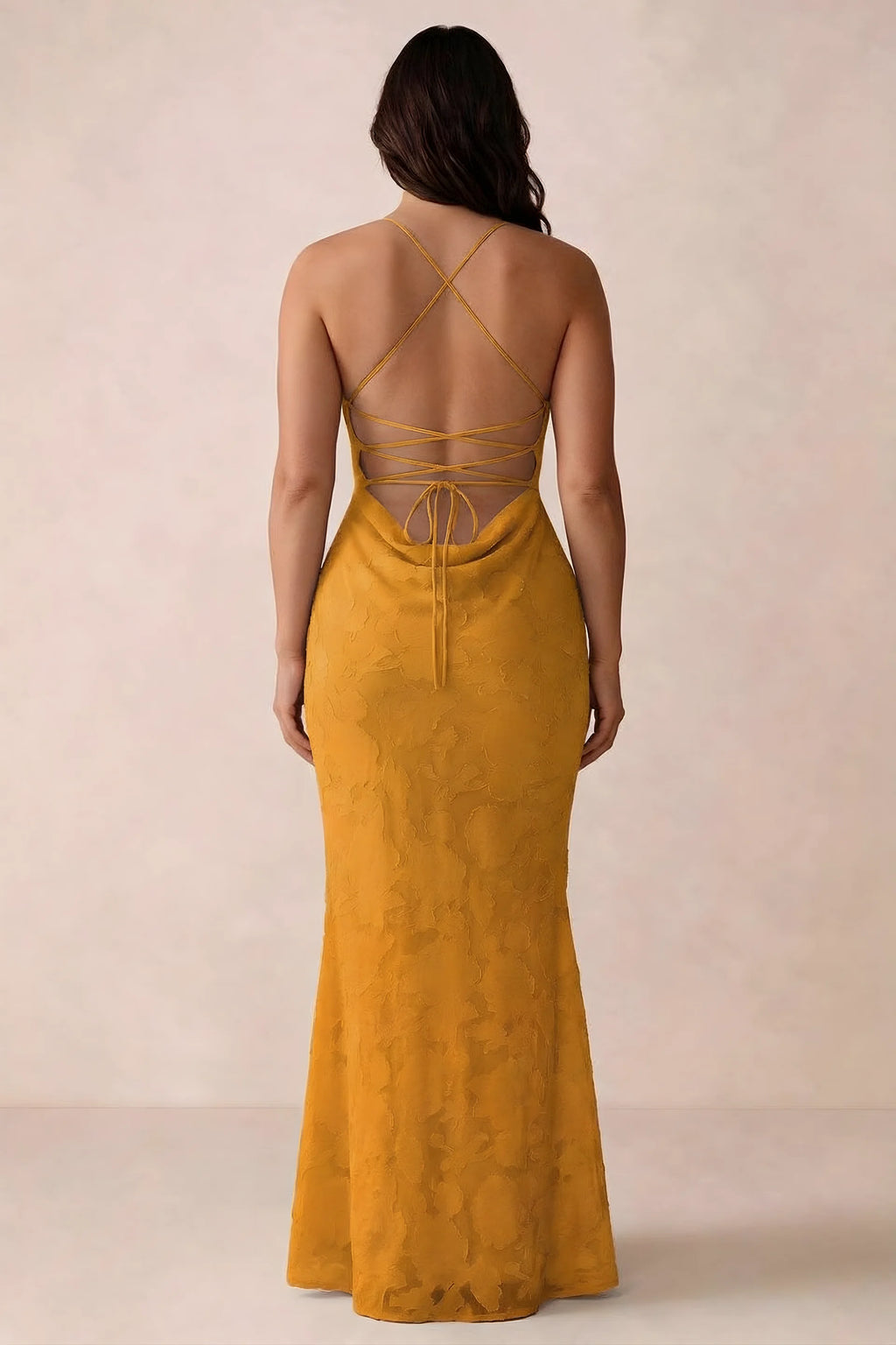 Back studio view of Bess butterscotch dress showing the crossed straps and full-length silhouette
