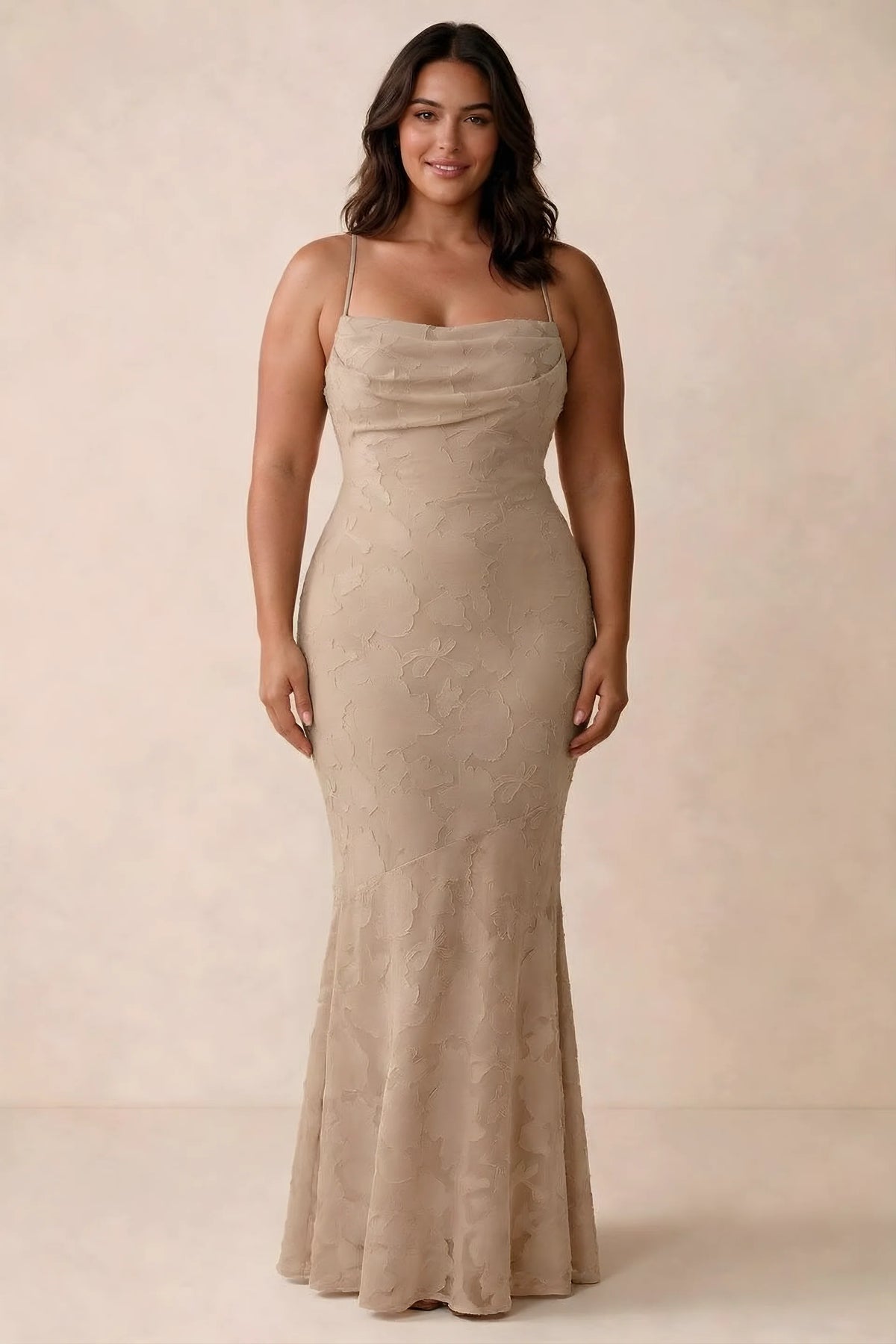 Front studio view of Bess champagne maxi dress showing tonal floral texture and a long skirt