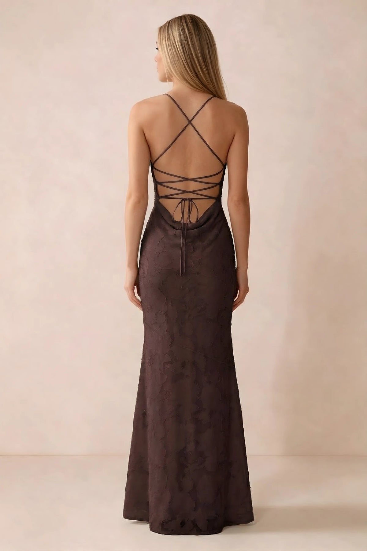 Rear studio view of Bess chocolate dress showing cross-back lacing above a low cowl drape