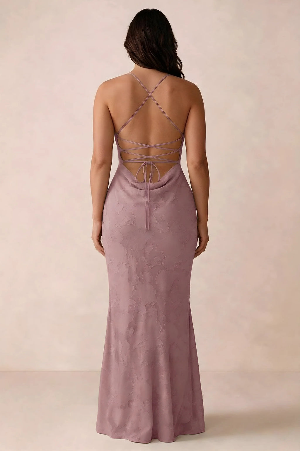 Back studio view of Bess dusty pink dress showing the crossed straps and full-length silhouette