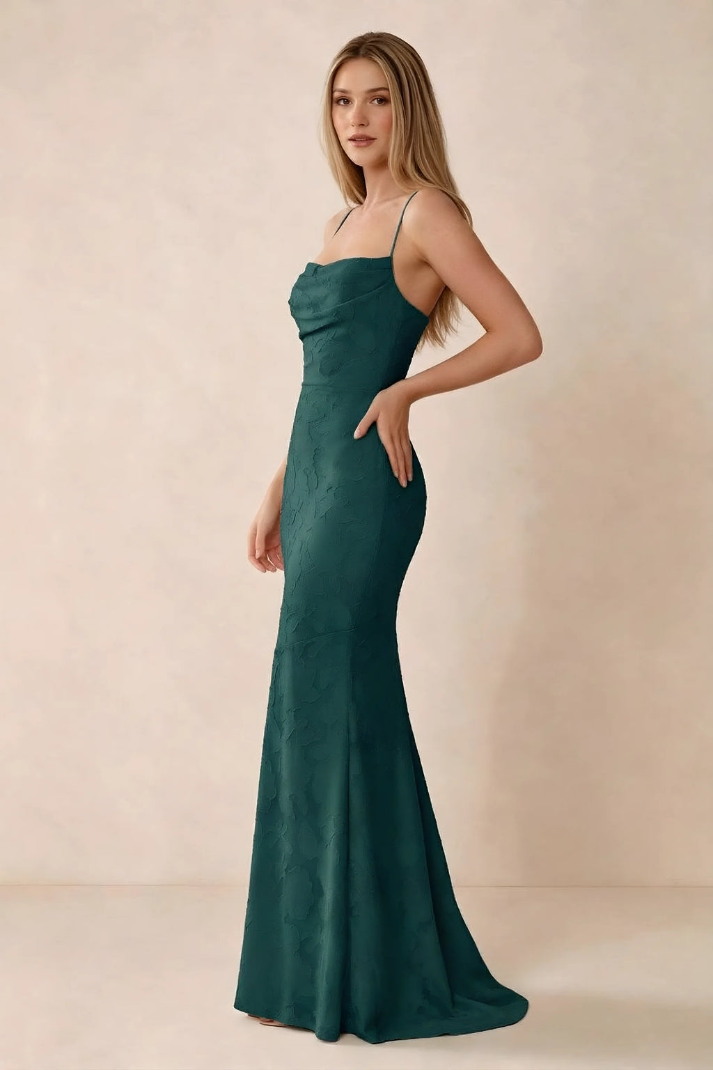 Three-quarter studio view of Bess forest green dress showing the close-fitting waist and gently flared hem