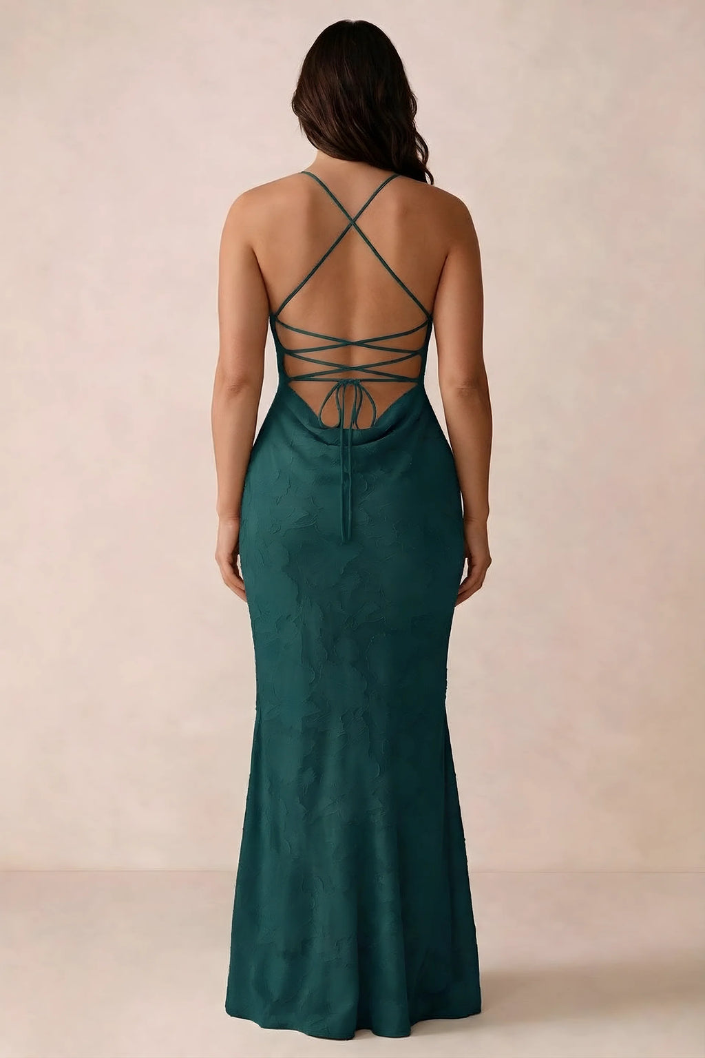 Back studio view of Bess forest green dress showing the crossed straps and full-length silhouette