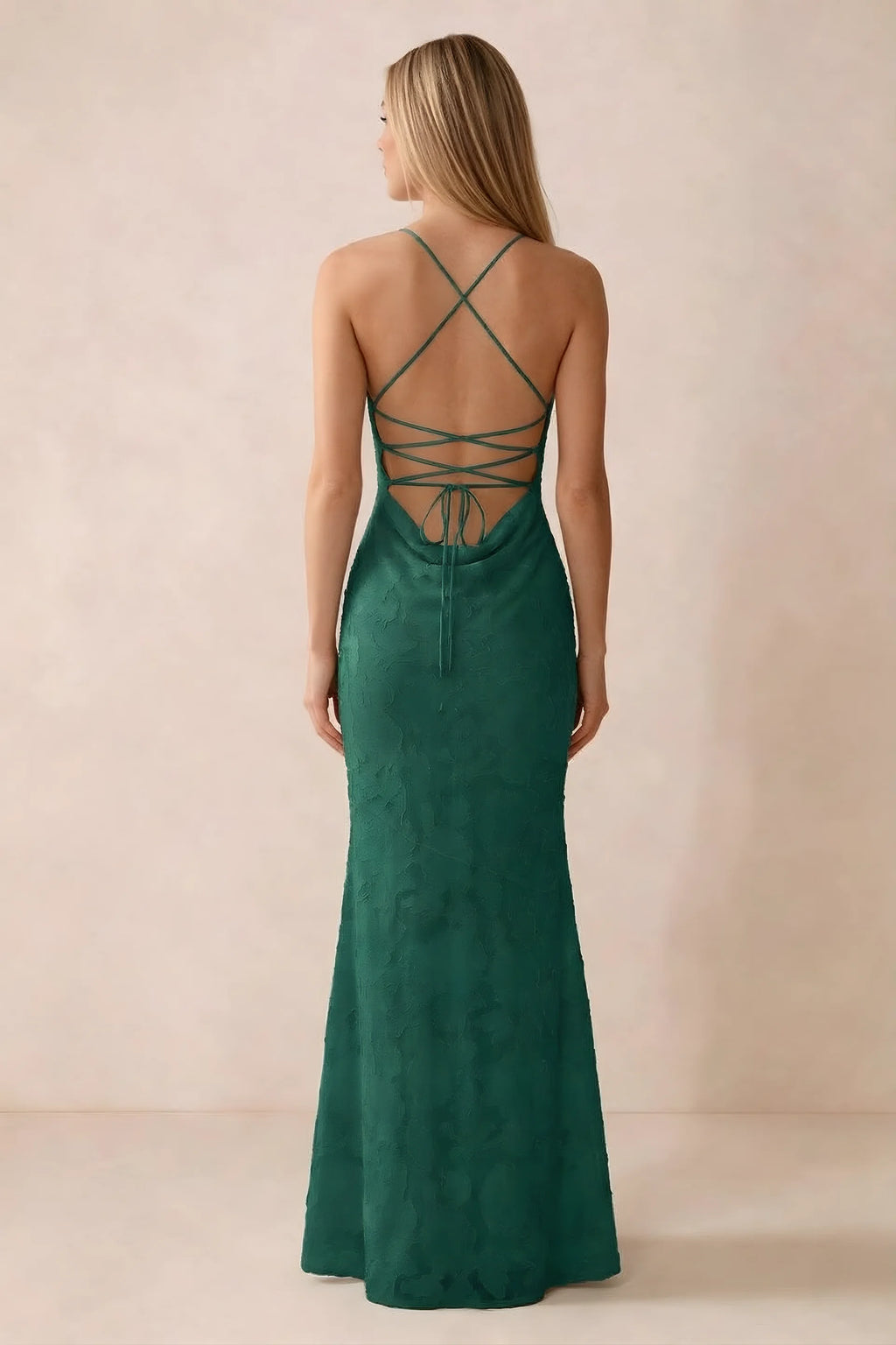 Rear studio view of Bess hunter green dress showing cross-back lacing above a low cowl drape