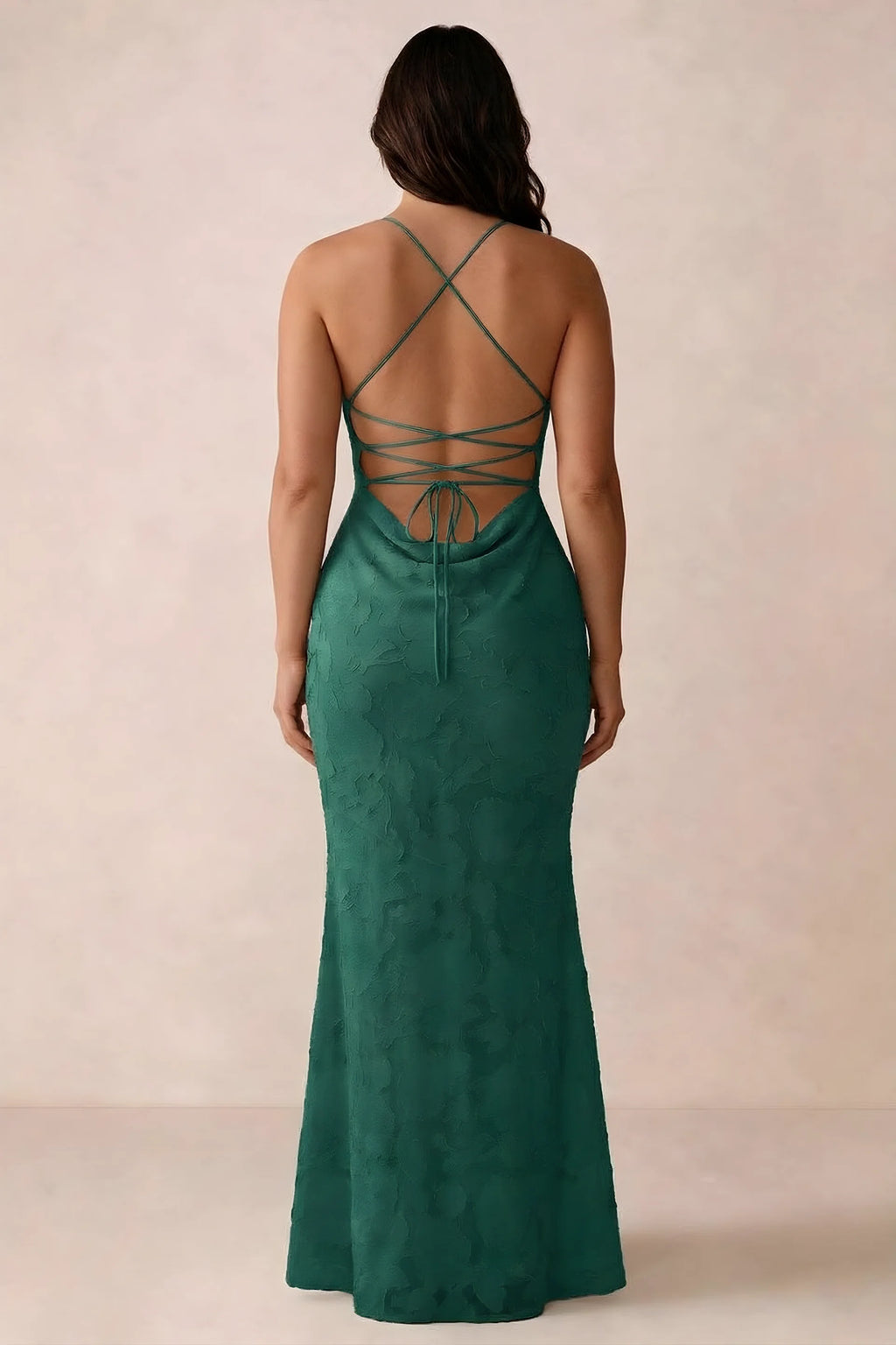 Back studio view of Bess hunter green dress showing the crossed straps and full-length silhouette