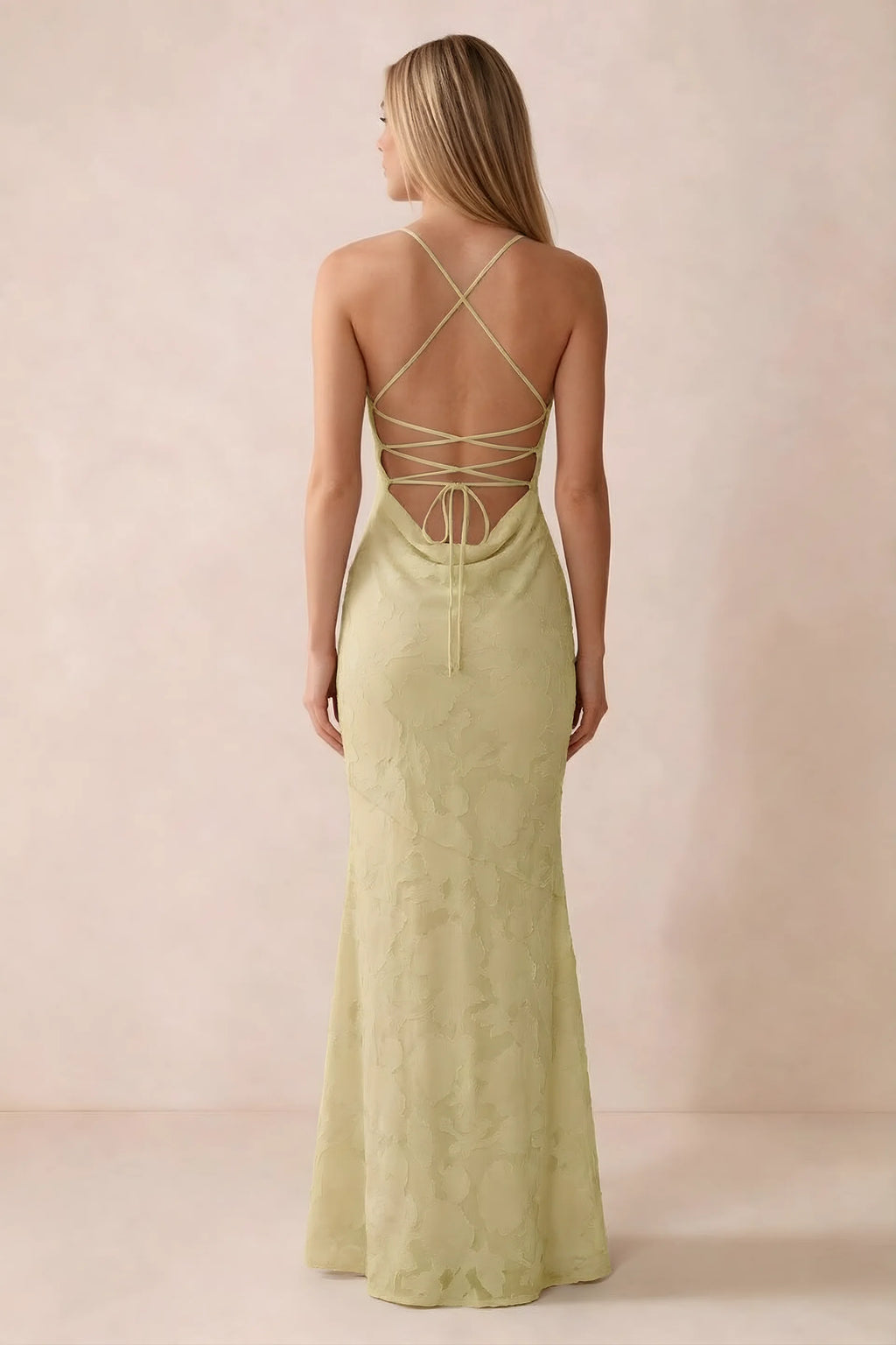Rear studio view of Bess lemon dress showing cross-back lacing above a low cowl drape