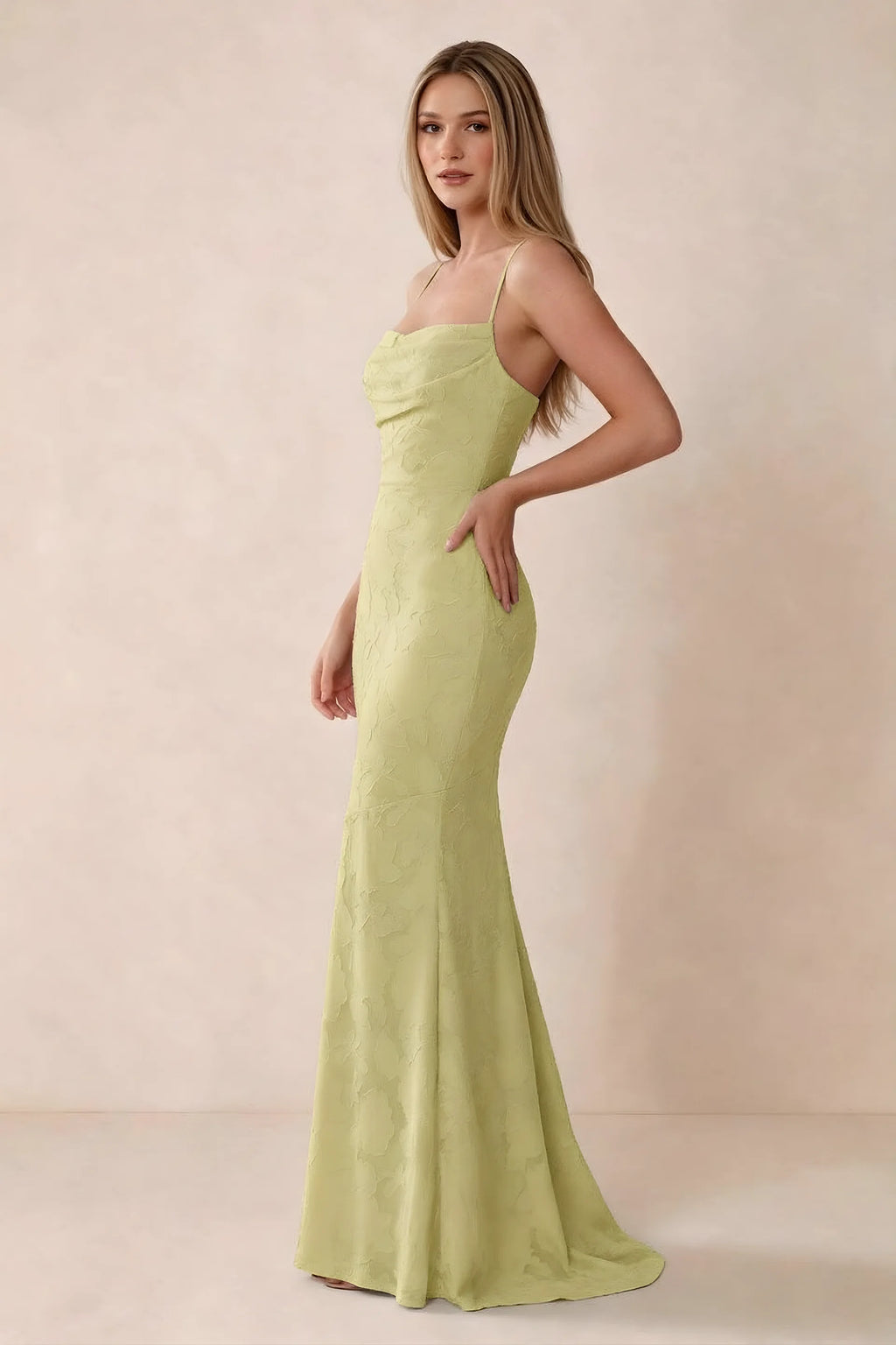 Three-quarter studio view of Bess lemon dress showing the close-fitting waist and gently flared hem