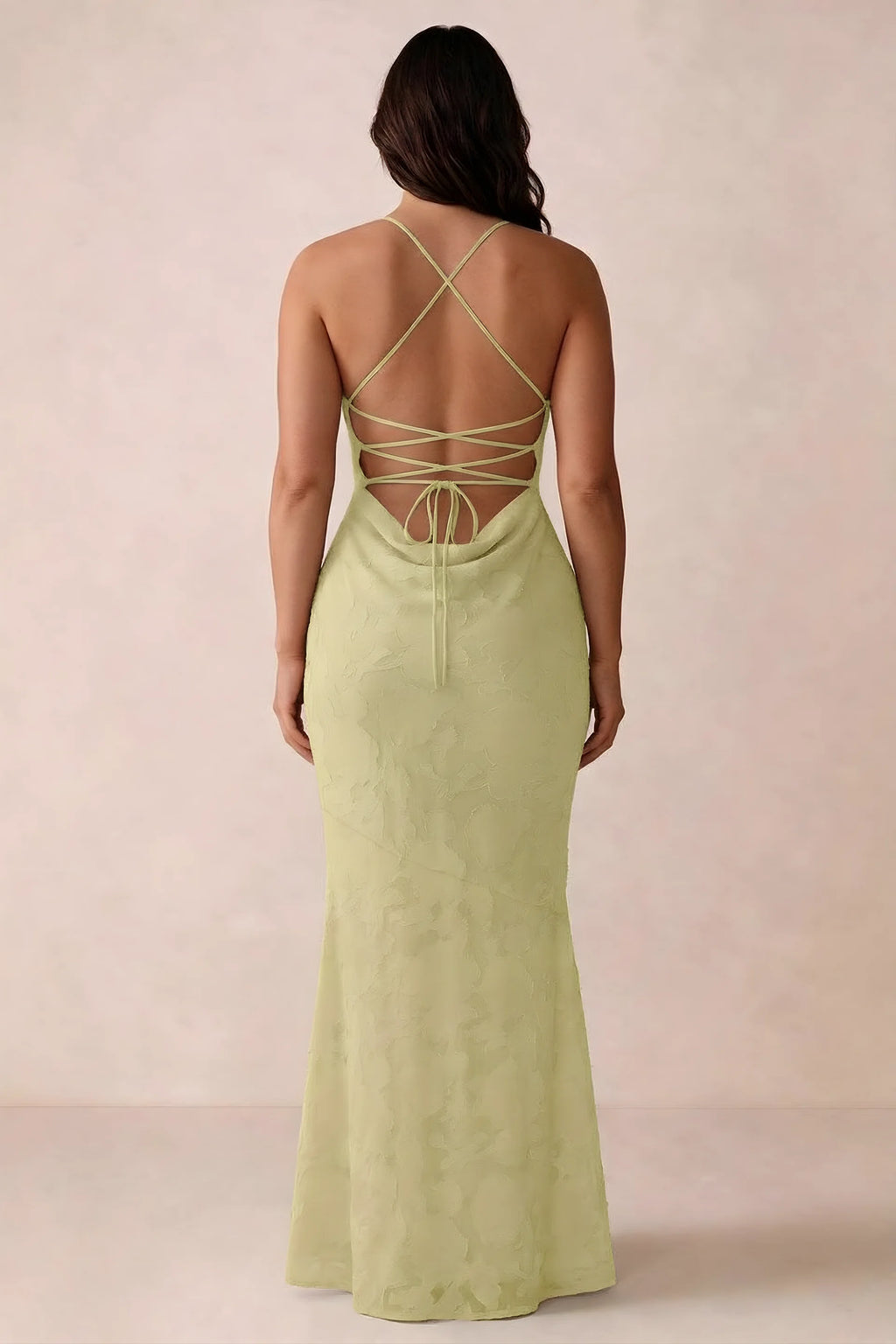 Back studio view of Bess lemon dress showing the crossed straps and full-length silhouette