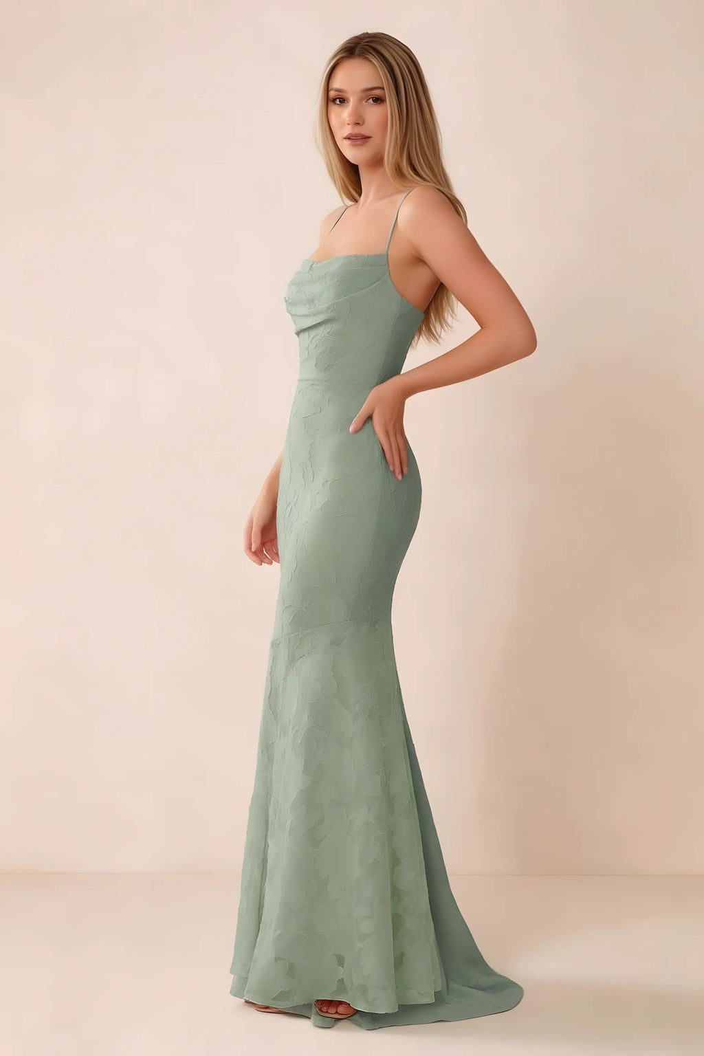 Three-quarter studio view of Bess light green dress showing the close-fitting waist and gently flared hem