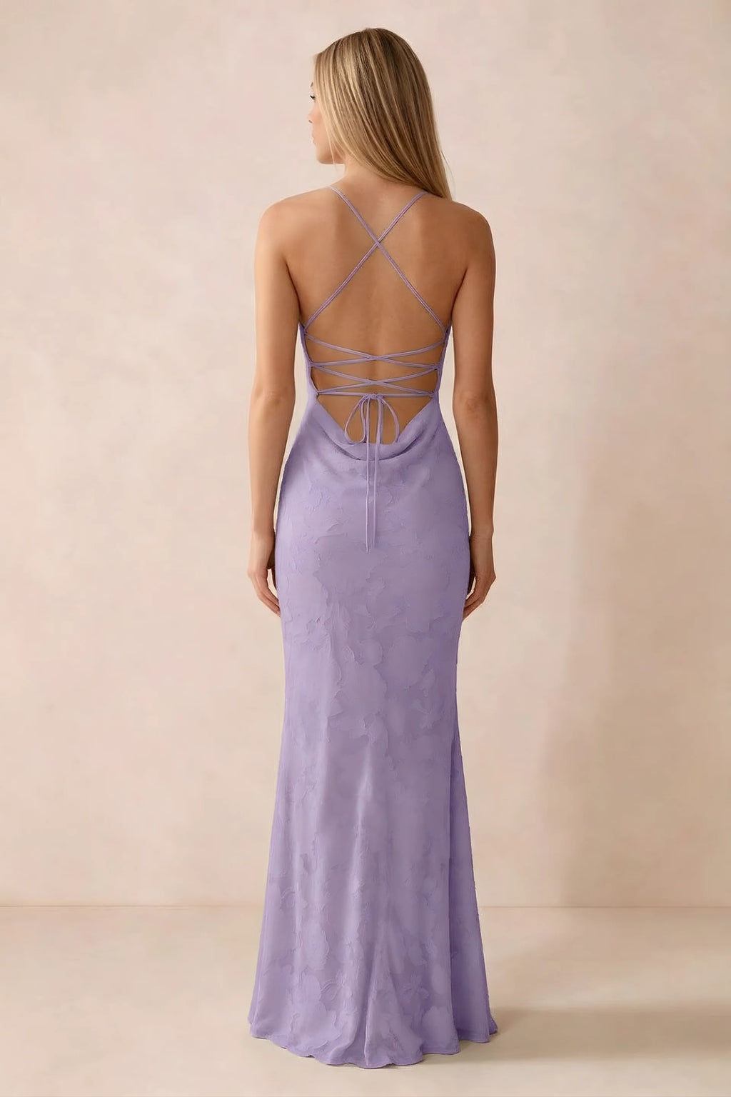 Rear studio view of Bess lilac dress showing cross-back lacing above a low cowl drape