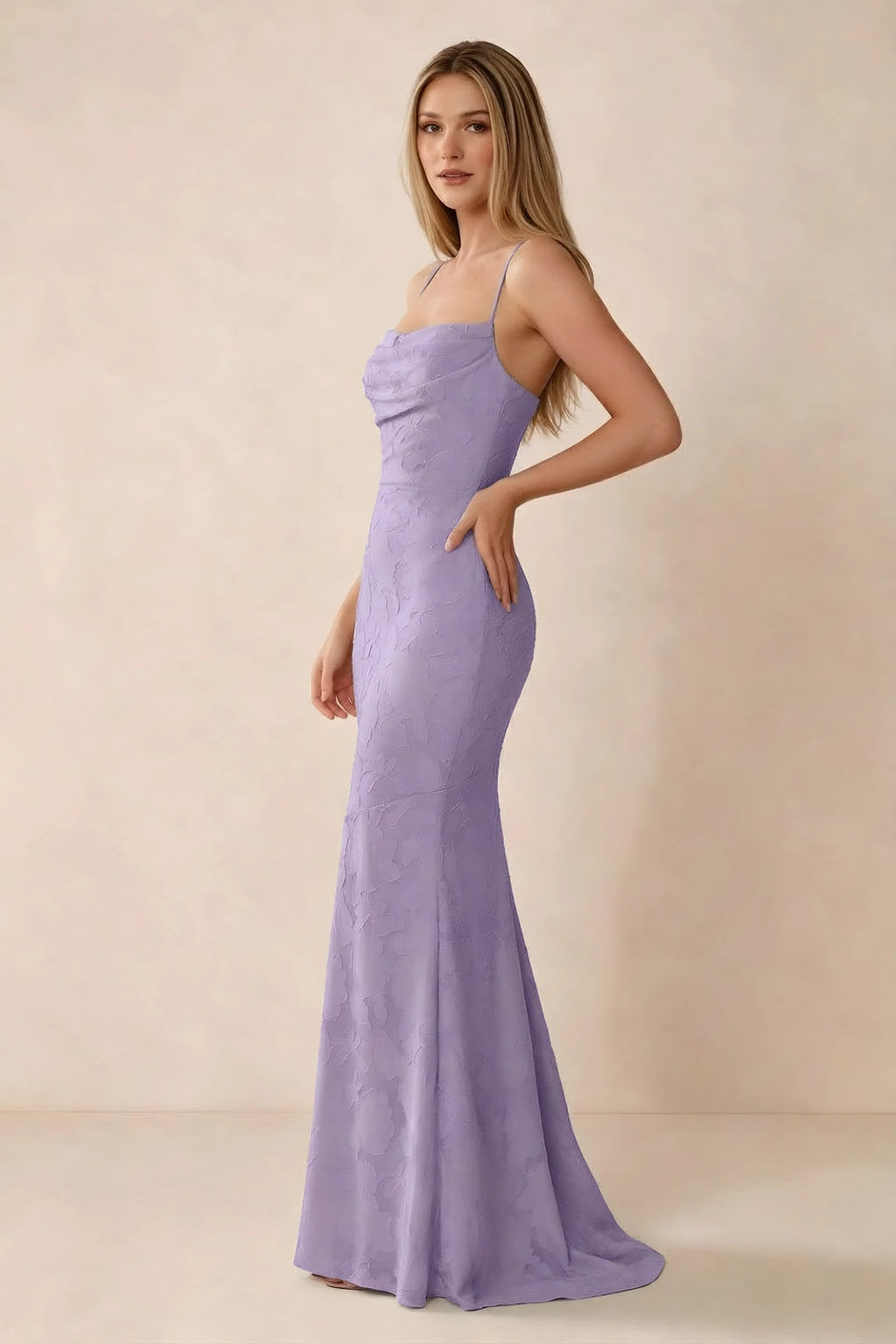 Three-quarter studio view of Bess lilac dress showing the close-fitting waist and gently flared hem
