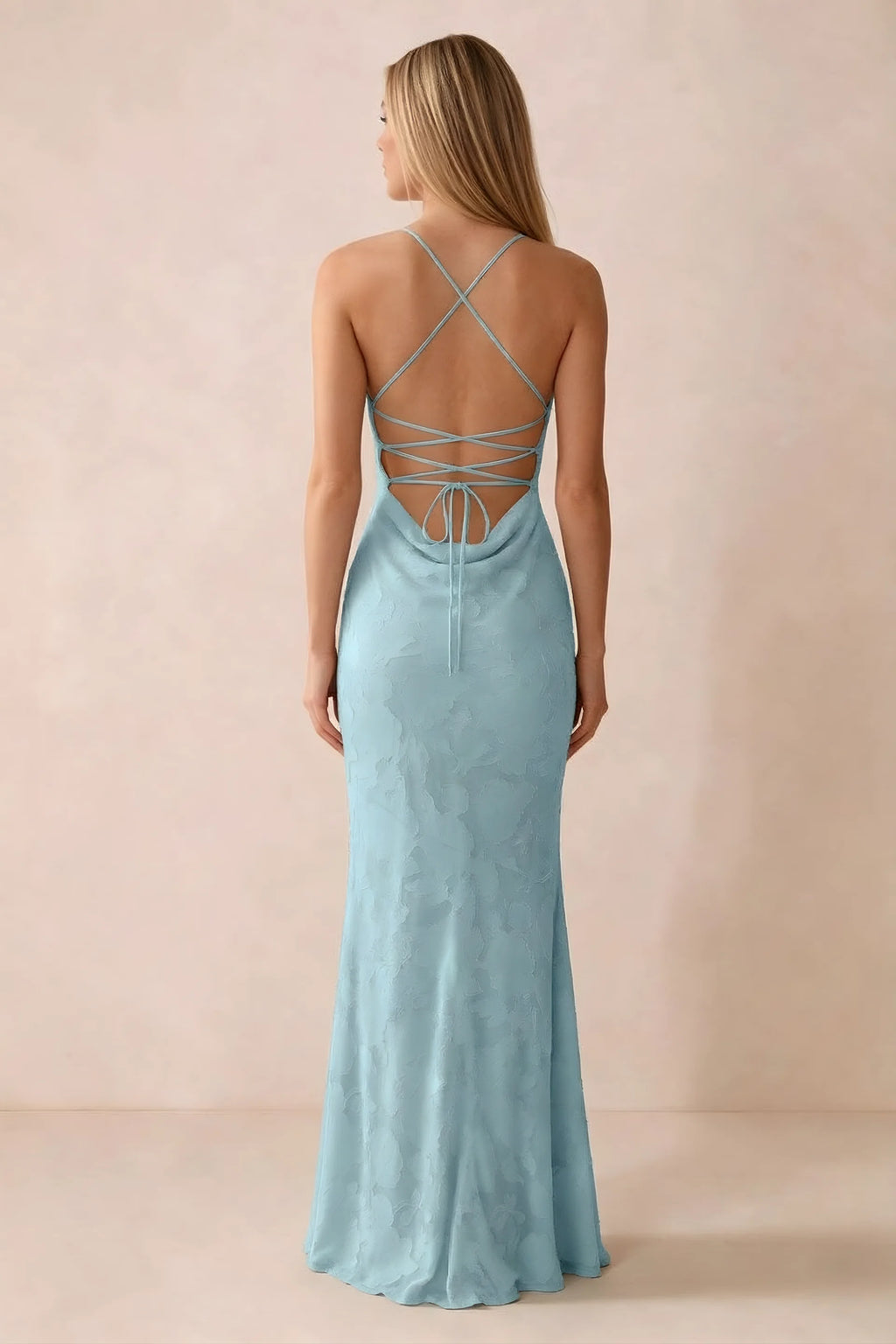 Rear studio view of Bess mist dress showing cross-back lacing above a low cowl drape