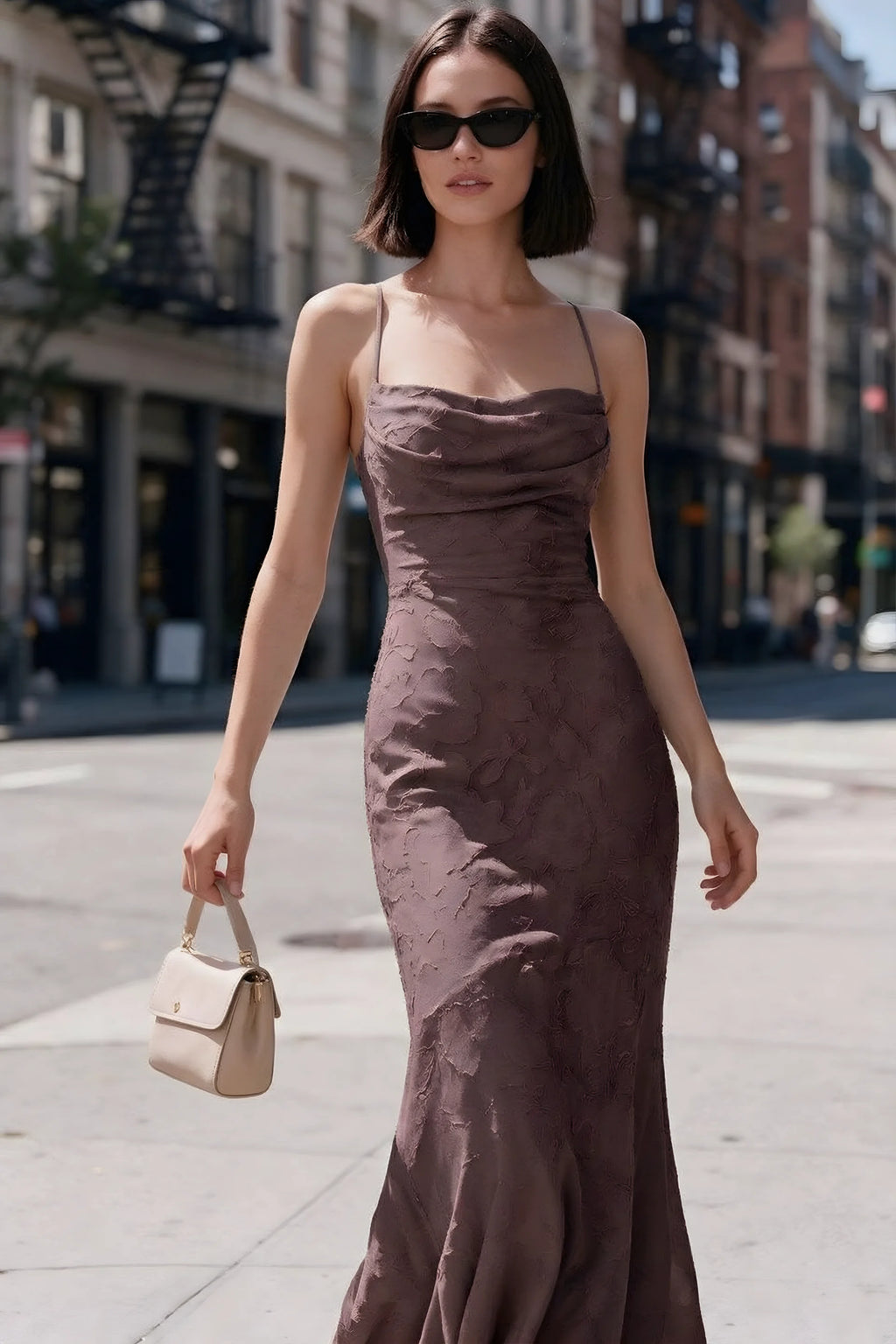 Outdoor front view of Bess mocha floral burnout dress styled with sunglasses on a city street