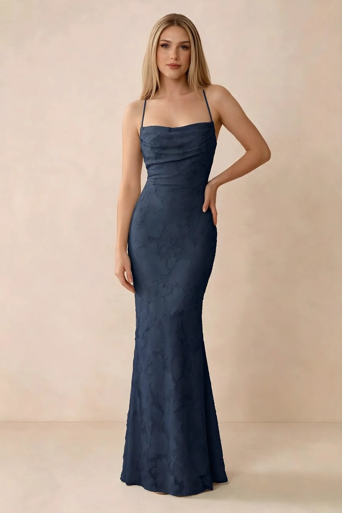 Front studio view of Bess navy floral burnout maxi dress with a draped cowl neckline and thin straps